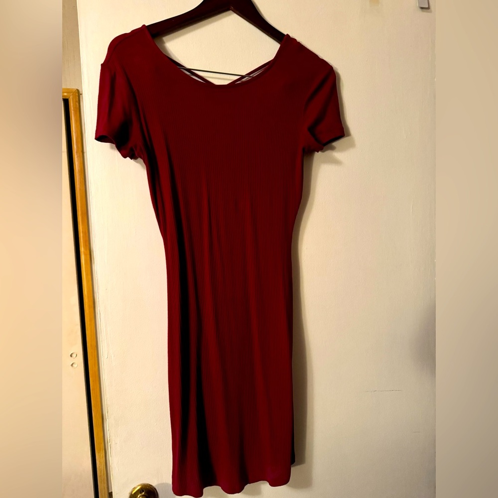 Burgundy bodycon dress with criss cross open back size medium.